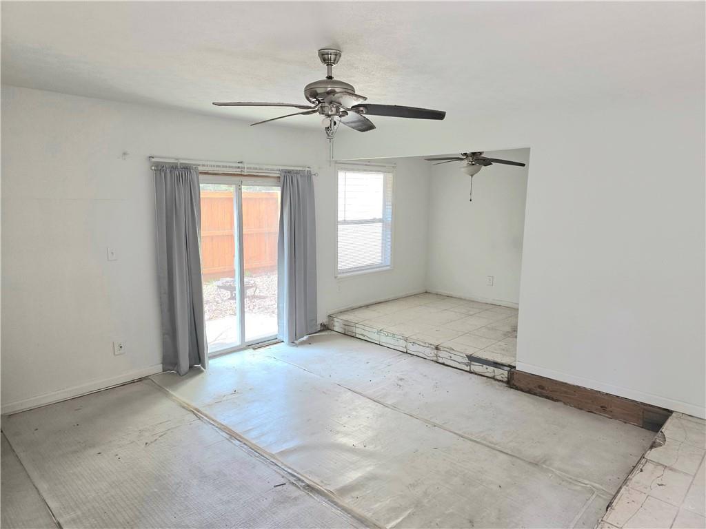 3183 Nectarine Circle Decatur, GA 30034 - Photo 6 of 15 an empty room with windows and fan