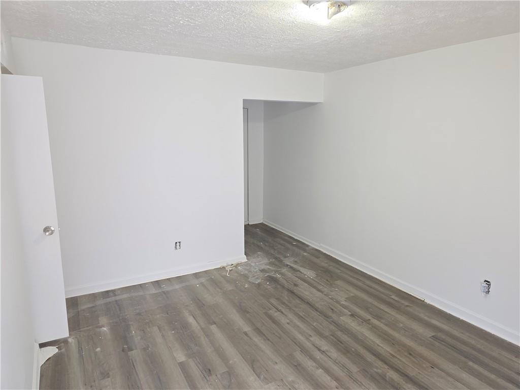 3183 Nectarine Circle Decatur, GA 30034 - Photo 9 of 15 a view of an empty room with wooden floor