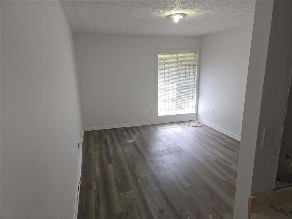 3183 Nectarine Circle Decatur, GA 30034 - Photo 10 of 15 an empty room with wooden floor and windows