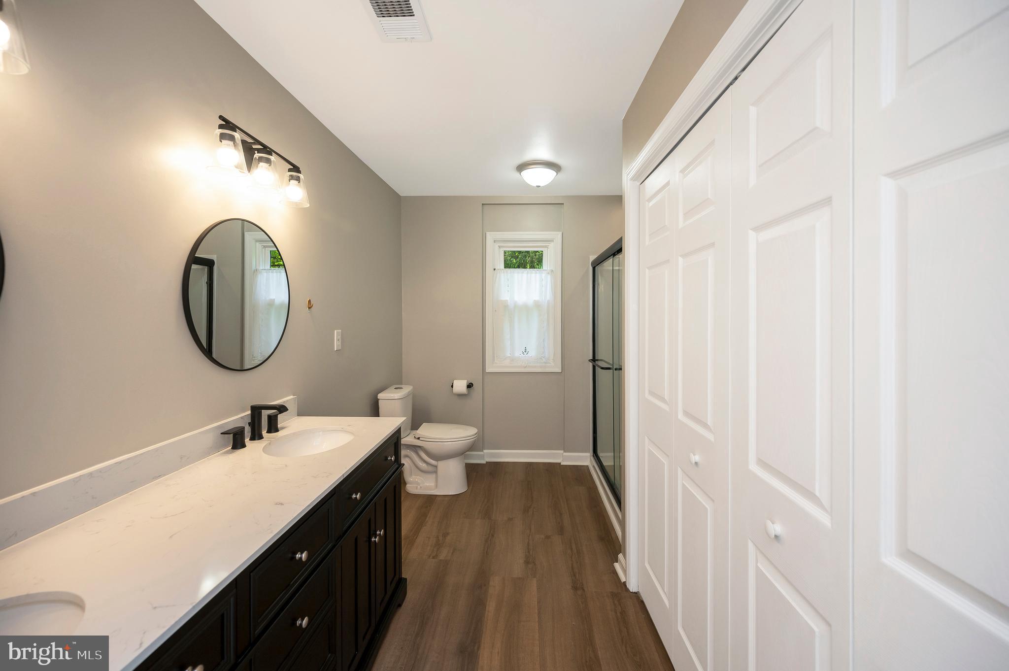 3195 Fiery Run Road Markham, VA 22643 - Photo 28 of 126 a en suite bathroom with a double vanity sink and a mirror