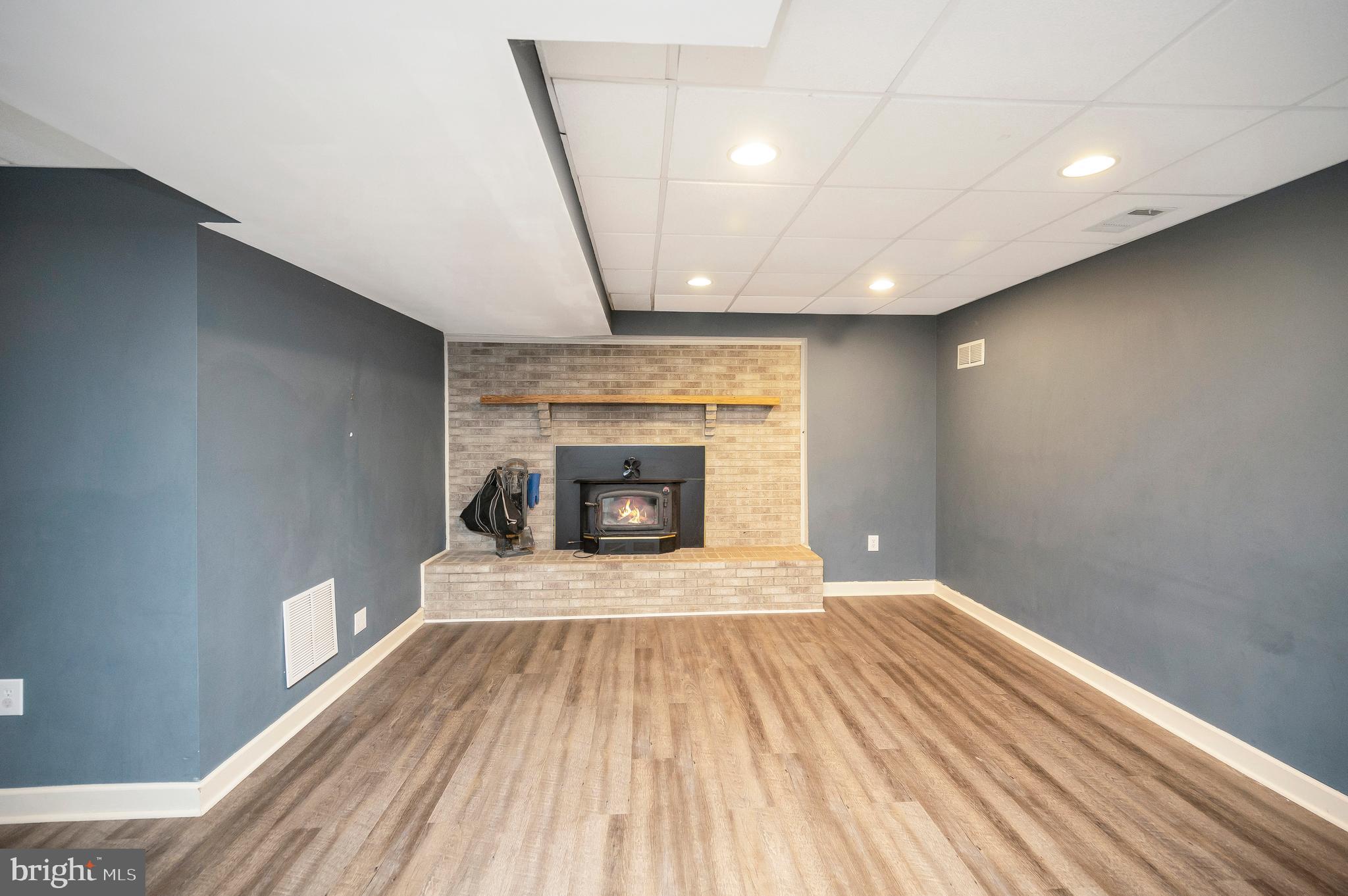 3195 Fiery Run Road Markham, VA 22643 - Photo 38 of 126 a view of empty room with wooden floor and fireplace