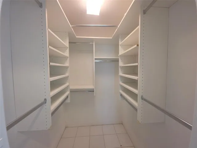 a view of an empty walk in closet