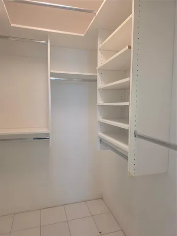 a view of an empty walk in closet
