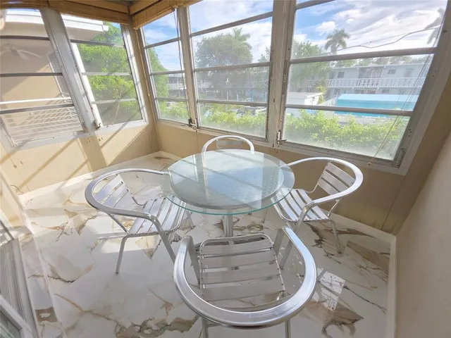 a very nice looking dining room with a table and chairs