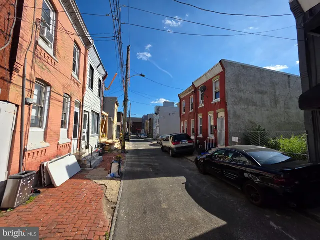 a car parked in front of brick building