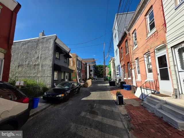a city street lined with buildings and cars