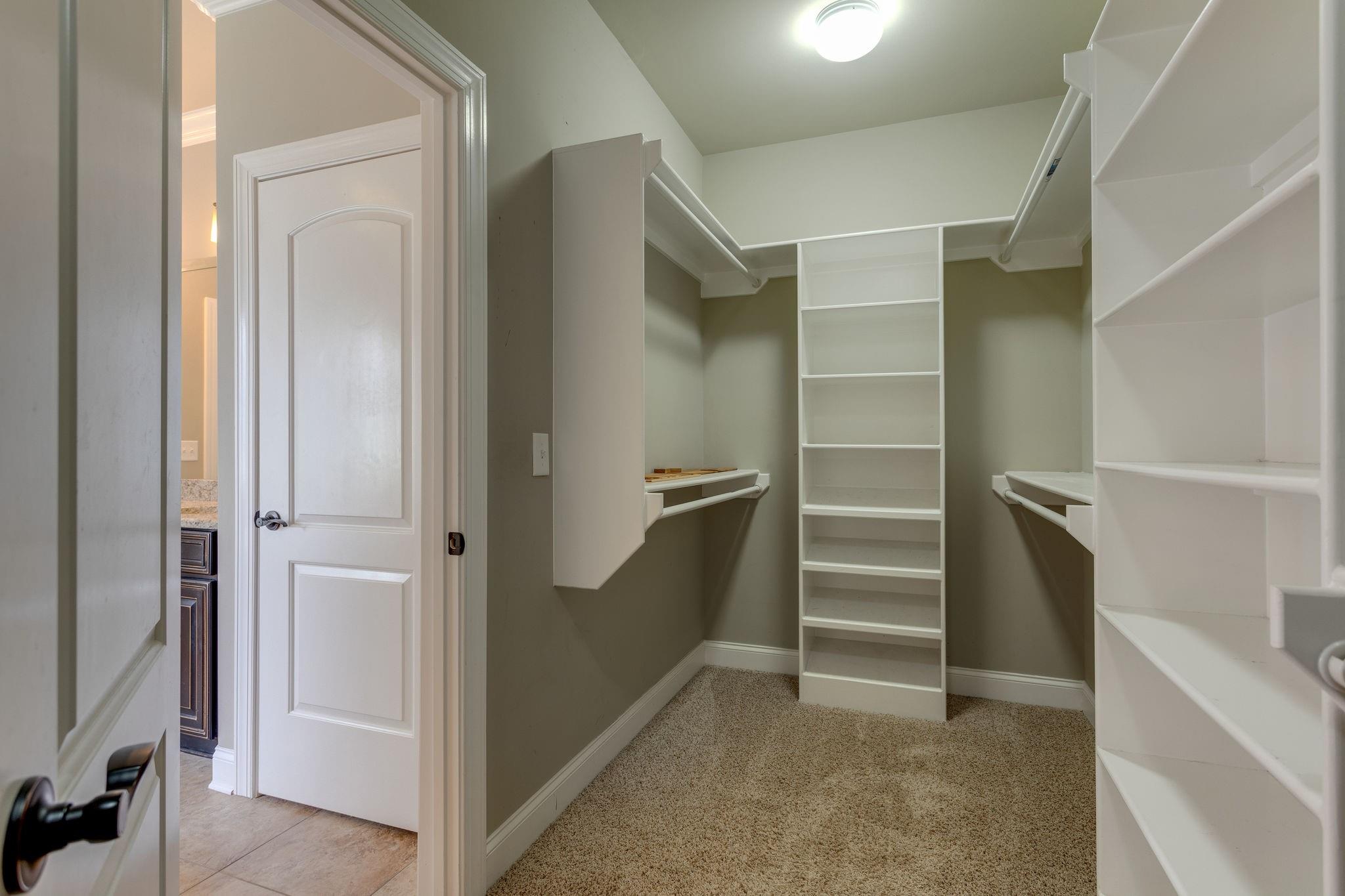 2075 Autumn Ridge Way Spring Hill, TN 37174 - Photo 17 of 27 Custom shelving in the owner's closet.