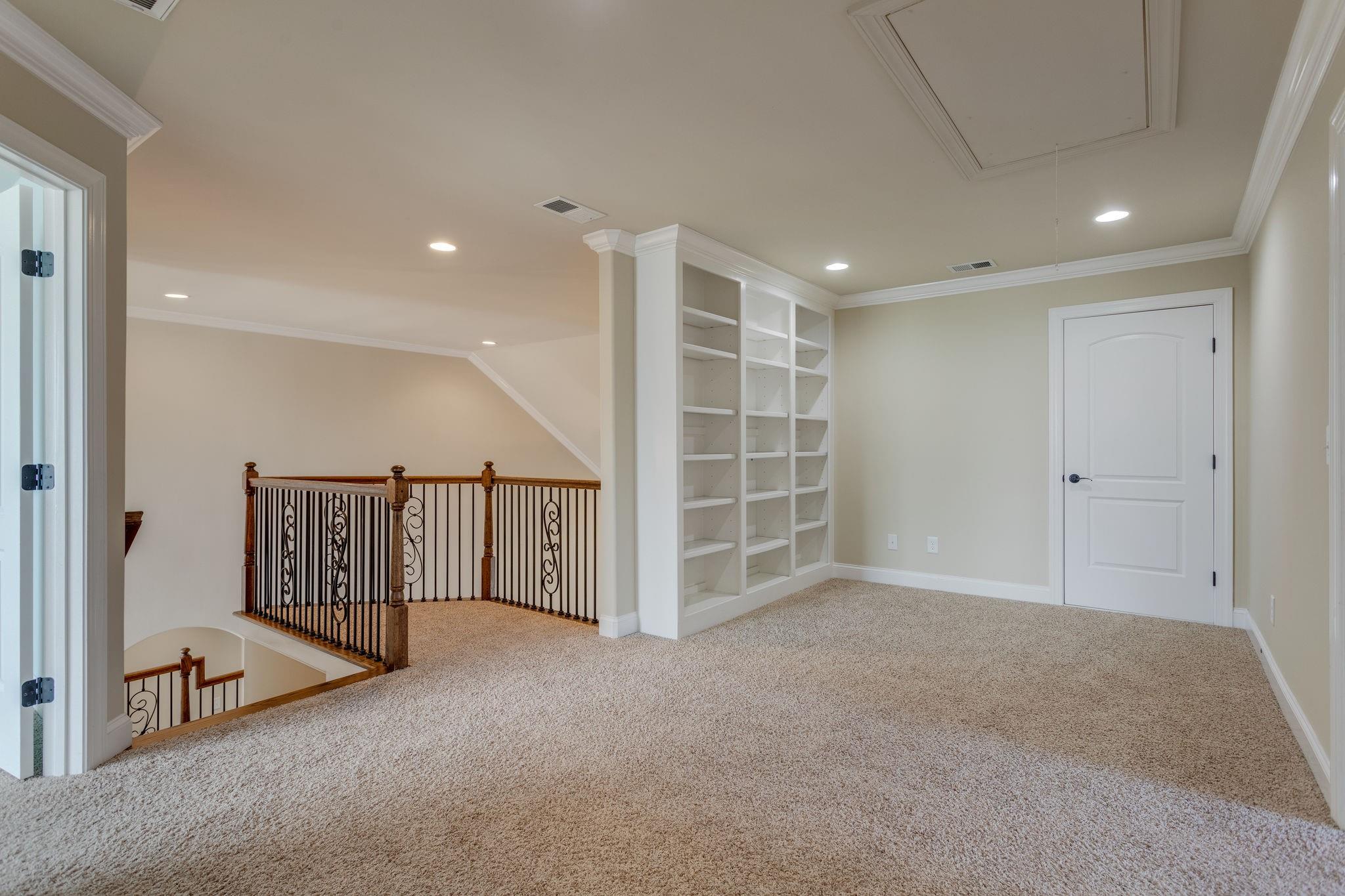 2075 Autumn Ridge Way Spring Hill, TN 37174 - Photo 21 of 27 Landing at top of stairs with Juliet balcony and built in shelving
