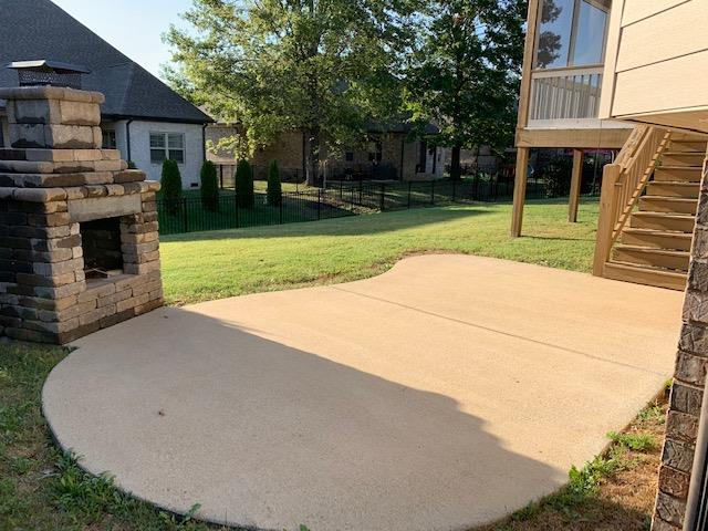 2075 Autumn Ridge Way Spring Hill, TN 37174 - Photo 27 of 27 Just off the deck is the patio and stone wood burning fireplace.