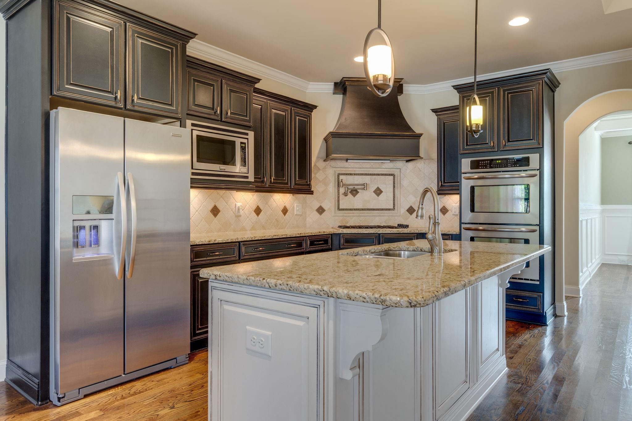 2075 Autumn Ridge Way Spring Hill, TN 37174 - Photo 9 of 27 Large island with built in sink. Great prep space. Full stainless appliance package