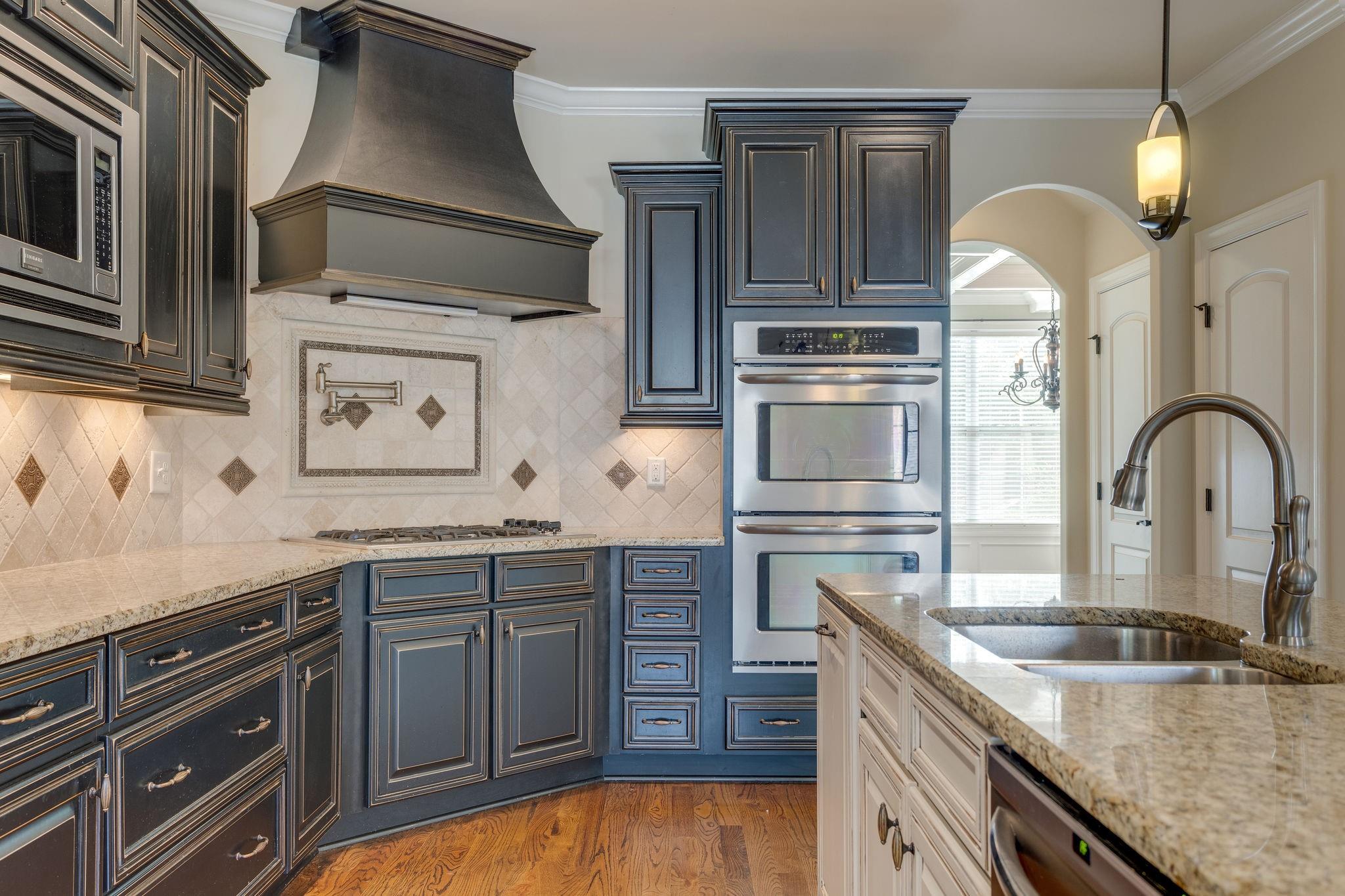 2075 Autumn Ridge Way Spring Hill, TN 37174 - Photo 10 of 27 Double ovens and pot filler over the gas range in your new kitchen