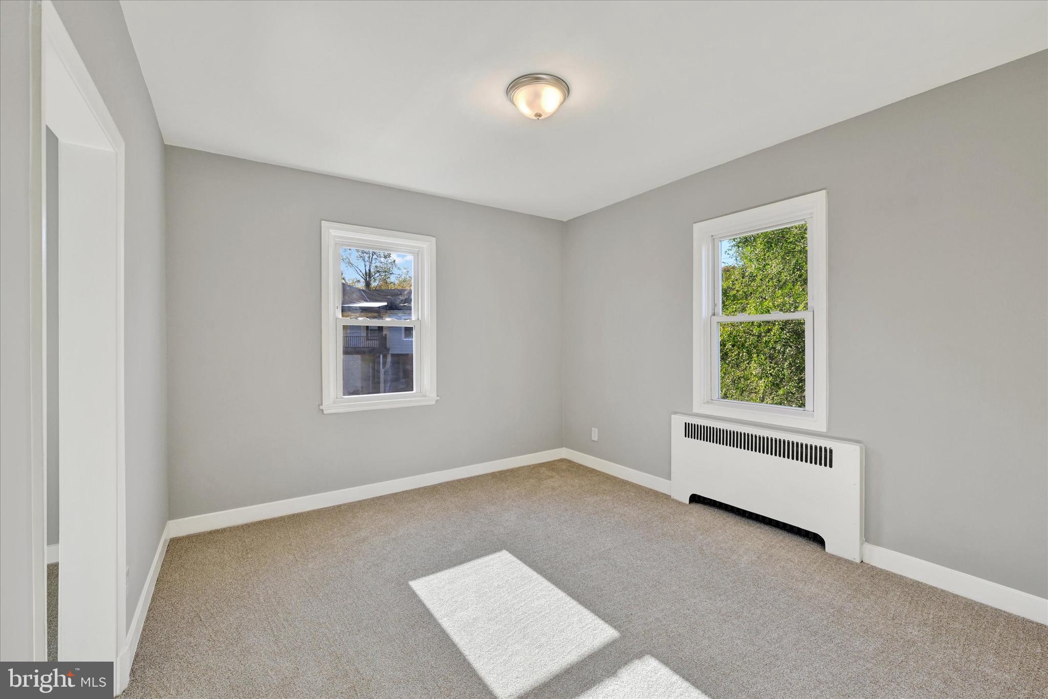 4811 Coleherne Road Baltimore, MD 21229 - Photo 14 of 28 an empty room with windows