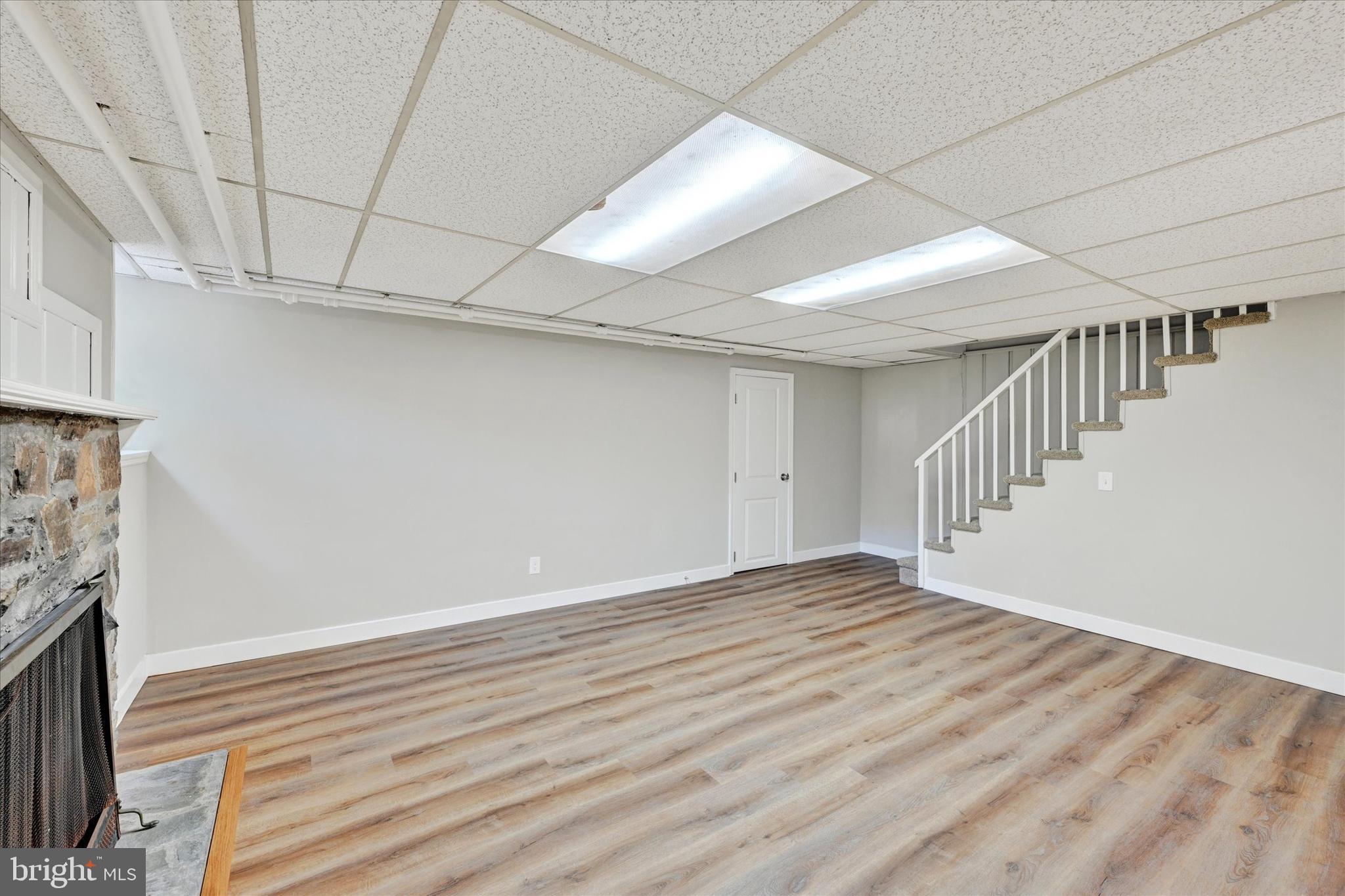 4811 Coleherne Road Baltimore, MD 21229 - Photo 21 of 28 a view of an empty room with a fireplace