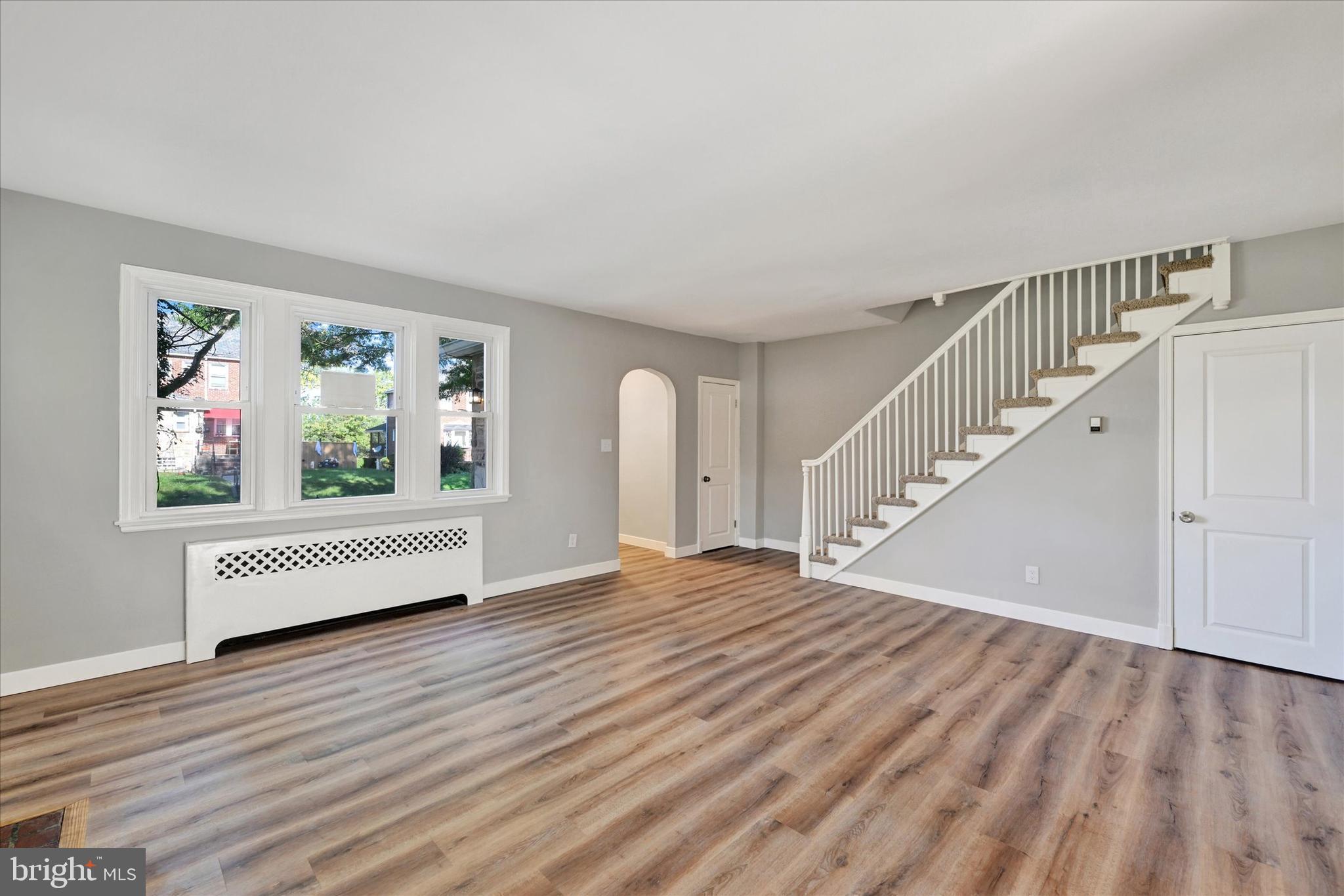 4811 Coleherne Road Baltimore, MD 21229 - Photo 4 of 28 a view of empty room with window and ceiling fan