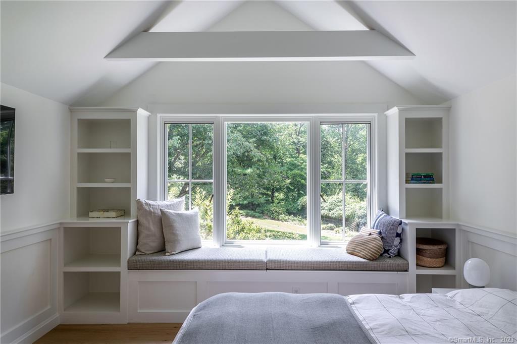 147 Wykeham Road Washington, CT 06793 - Photo 26 of 40 Primary bedroom w/built-in window seat and shelving.
