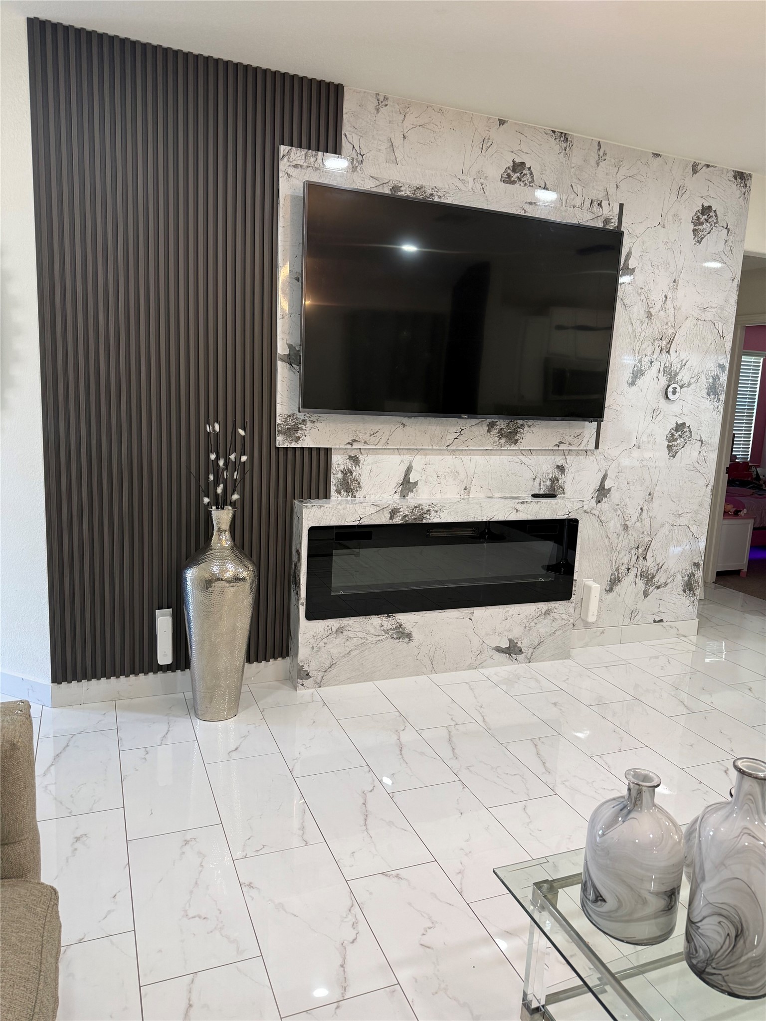 216 Star Pass Jarrell, TX 76537 - Photo 4 of 11 a living room with a flat screen tv and kitchen view