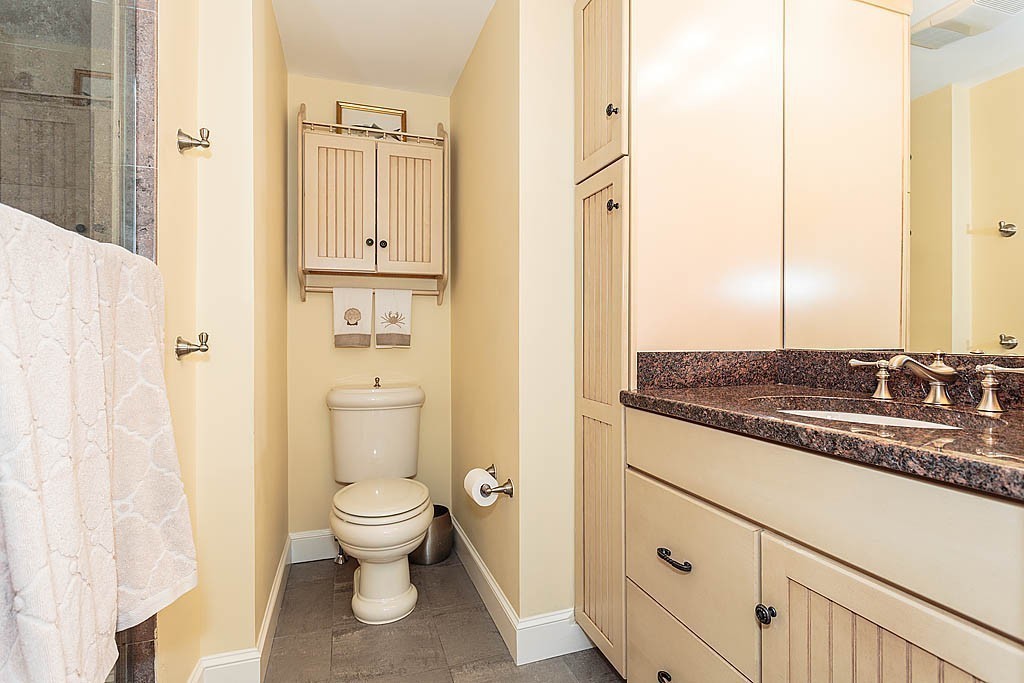 23 Jefferson Road Winchester, MA 01890 - Photo 16 of 30 a bathroom with a granite countertop sink toilet and shower