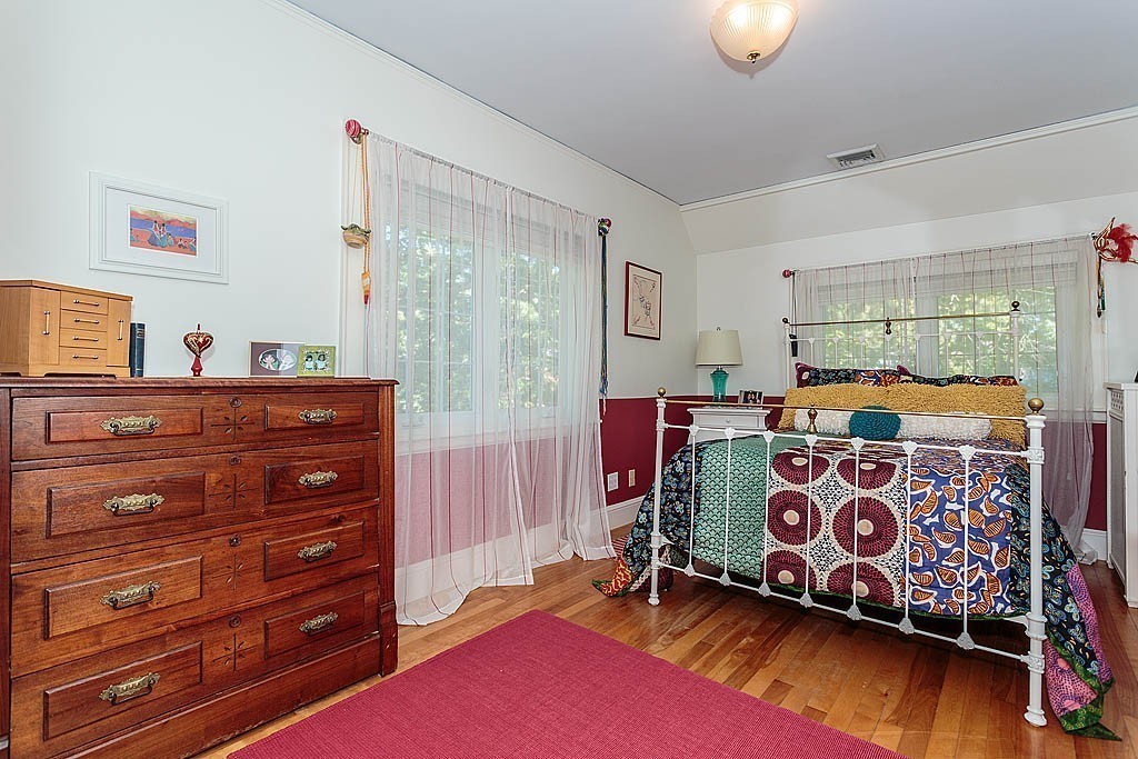 23 Jefferson Road Winchester, MA 01890 - Photo 19 of 30 a bedroom with a bed and a dresser