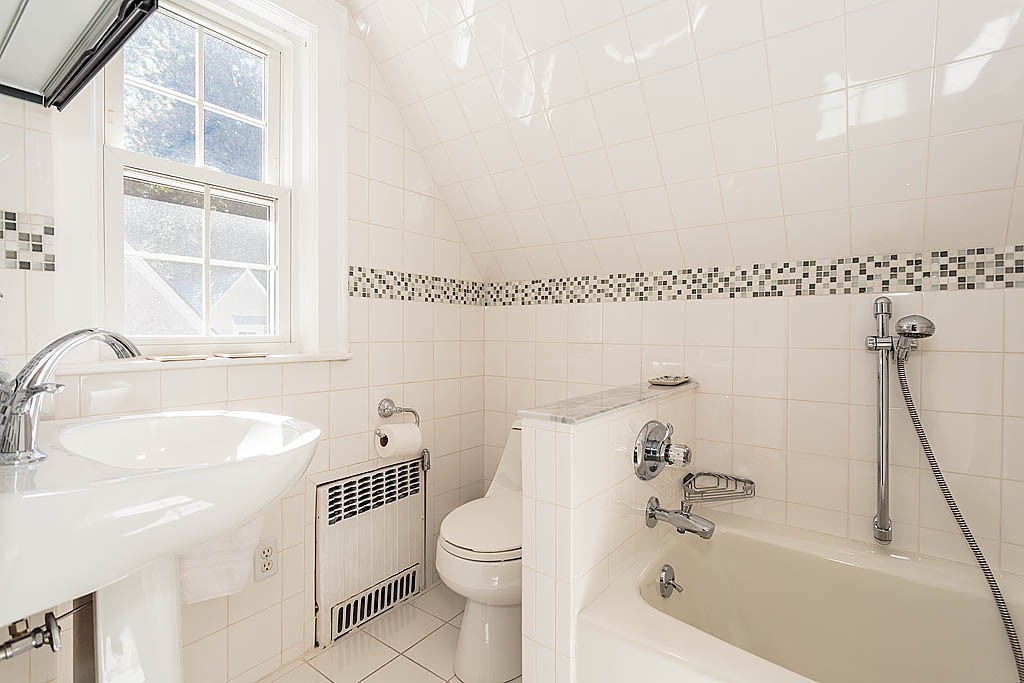 23 Jefferson Road Winchester, MA 01890 - Photo 21 of 30 a bathroom with a sink a toilet and a bathtub