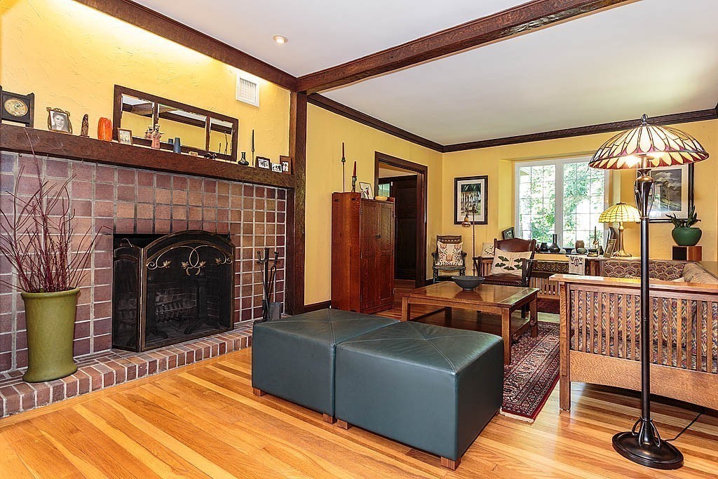 23 Jefferson Road Winchester, MA 01890 - Photo 6 of 30 a living room with furniture a fireplace and a table