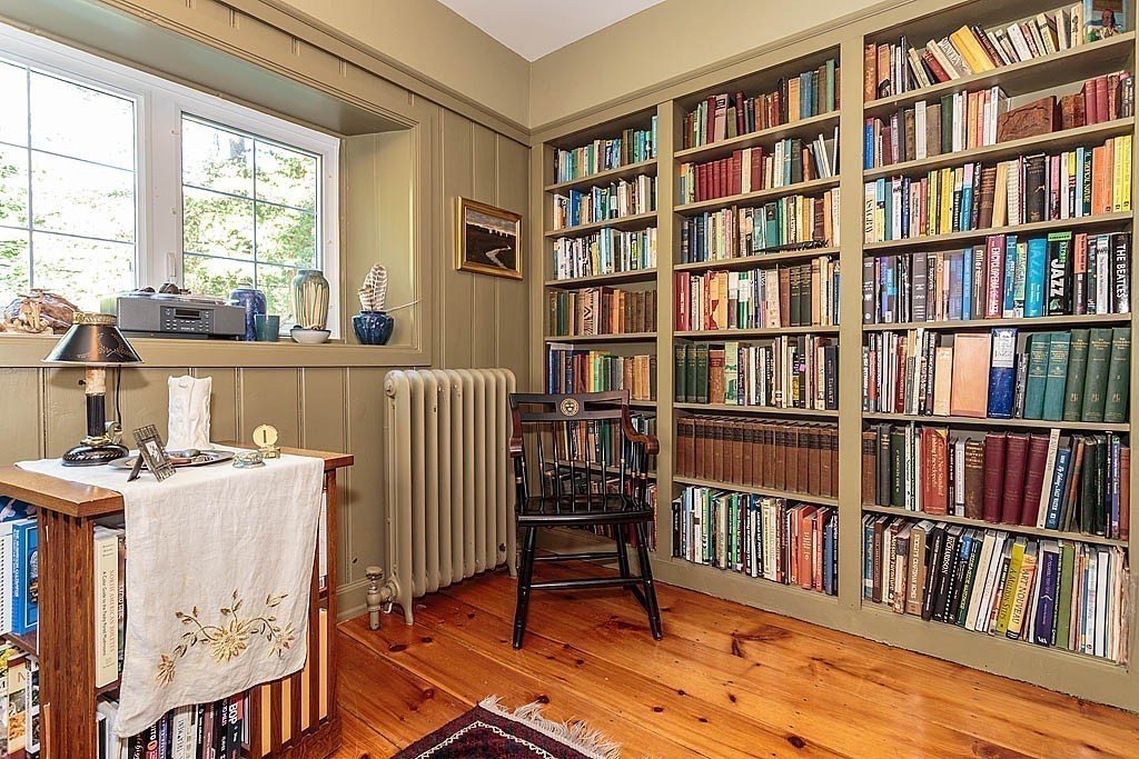 23 Jefferson Road Winchester, MA 01890 - Photo 8 of 30 a living room with a book shelf and a book shelf