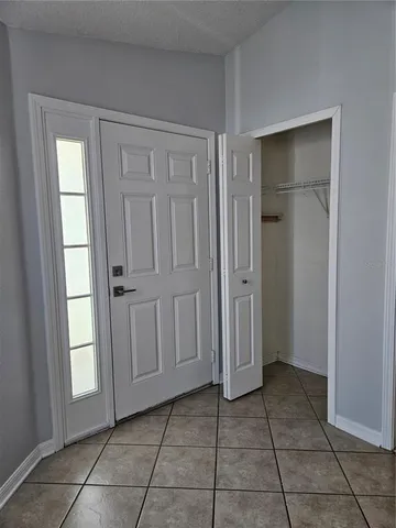 a view of an empty room and a window