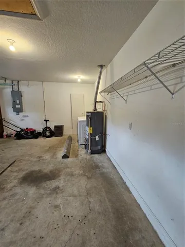 a bedroom with a bed and a mirror