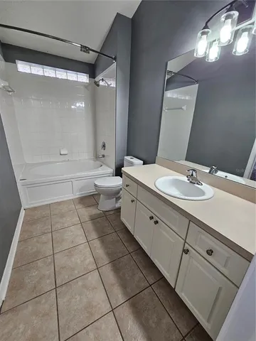 a view of a room with wooden floor and staircase