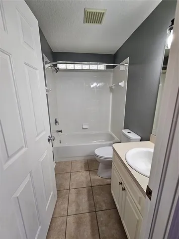 a view of an empty room and glass door