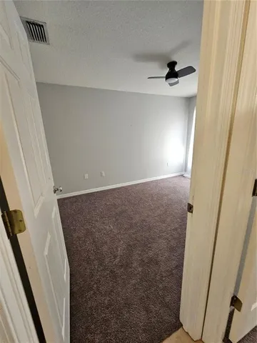 a kitchen with stainless steel appliances granite countertop a stove a sink a refrigerator a microwave and cabinets