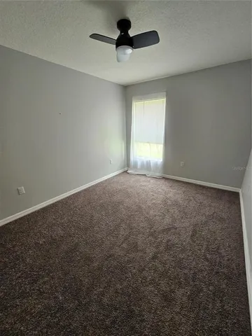 a view of empty room with windows