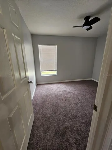 a kitchen with a sink a stove and cabinets