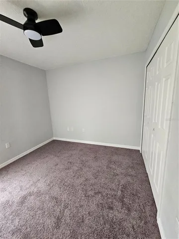 a view of an empty room with a sliding door