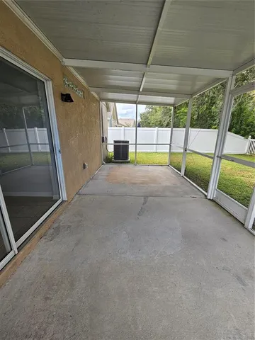 a view of yard with large trees