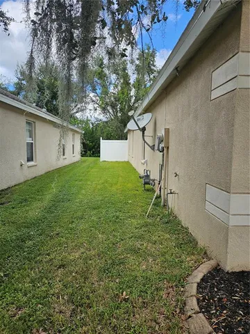 a backyard of a house with lots of green space