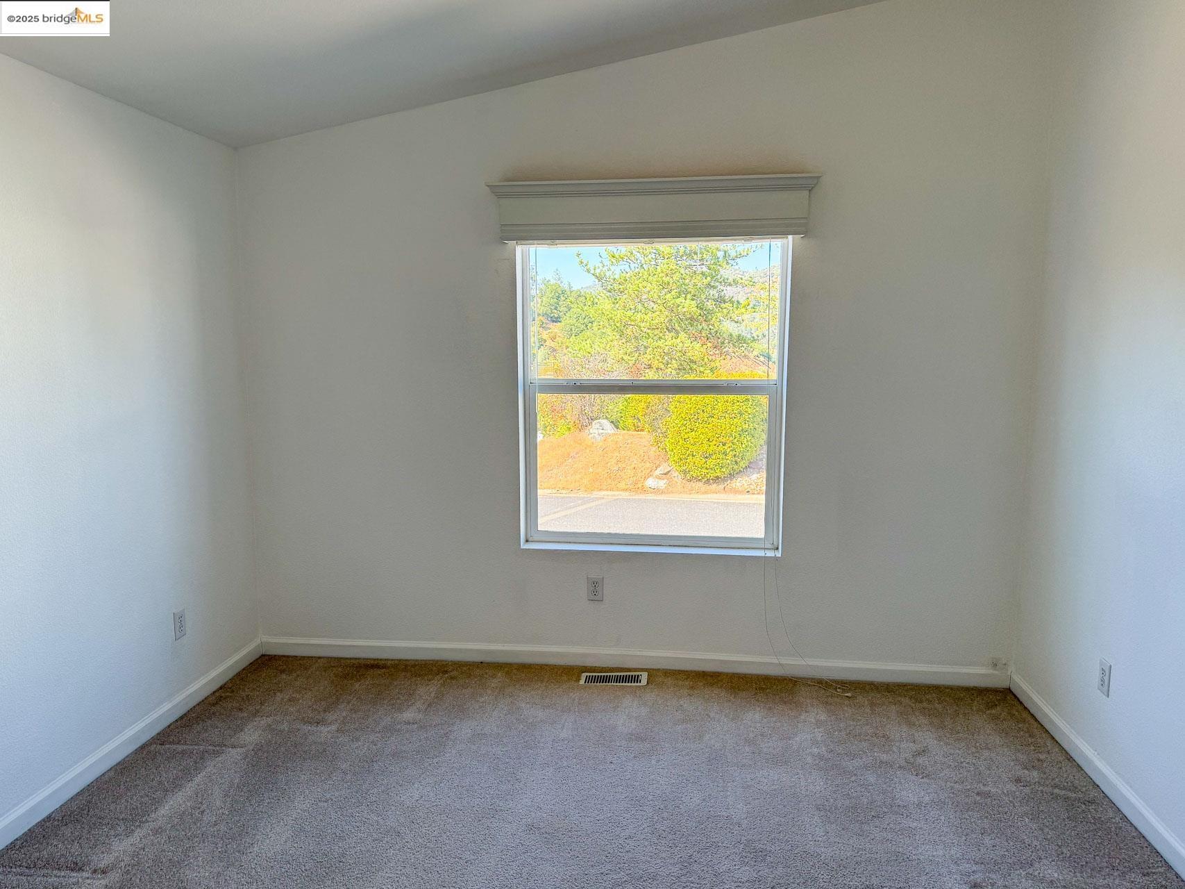18717 Mill Villa Road, Unit 637 Jamestown, CA 95327 - Photo 13 of 19 an empty room with a window