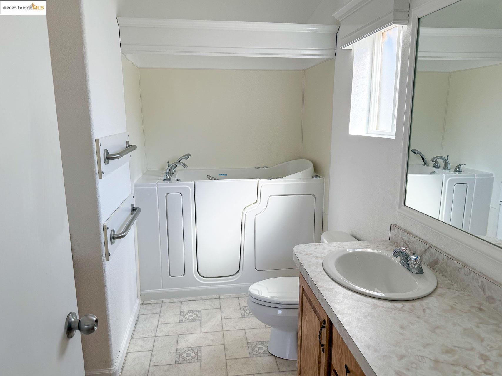 18717 Mill Villa Road, Unit 637 Jamestown, CA 95327 - Photo 15 of 19 a bathroom with a sink toilet and a mirror
