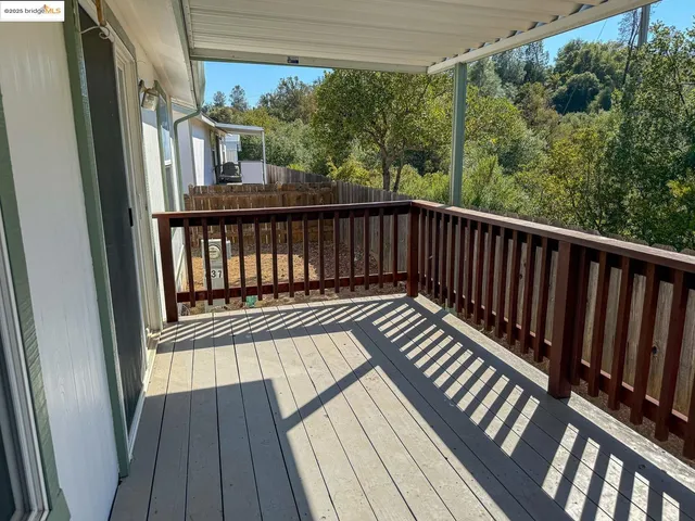 a view of balcony with wooden floor