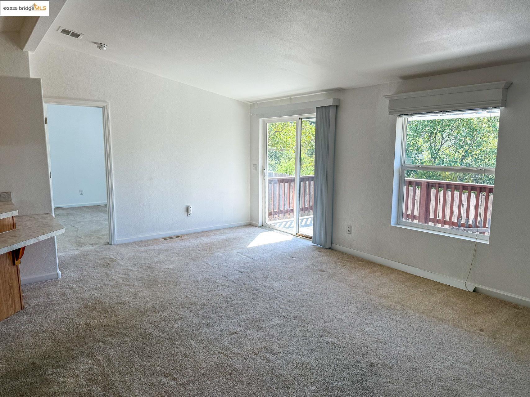 18717 Mill Villa Road, Unit 637 Jamestown, CA 95327 - Photo 3 of 19 an empty room with windows