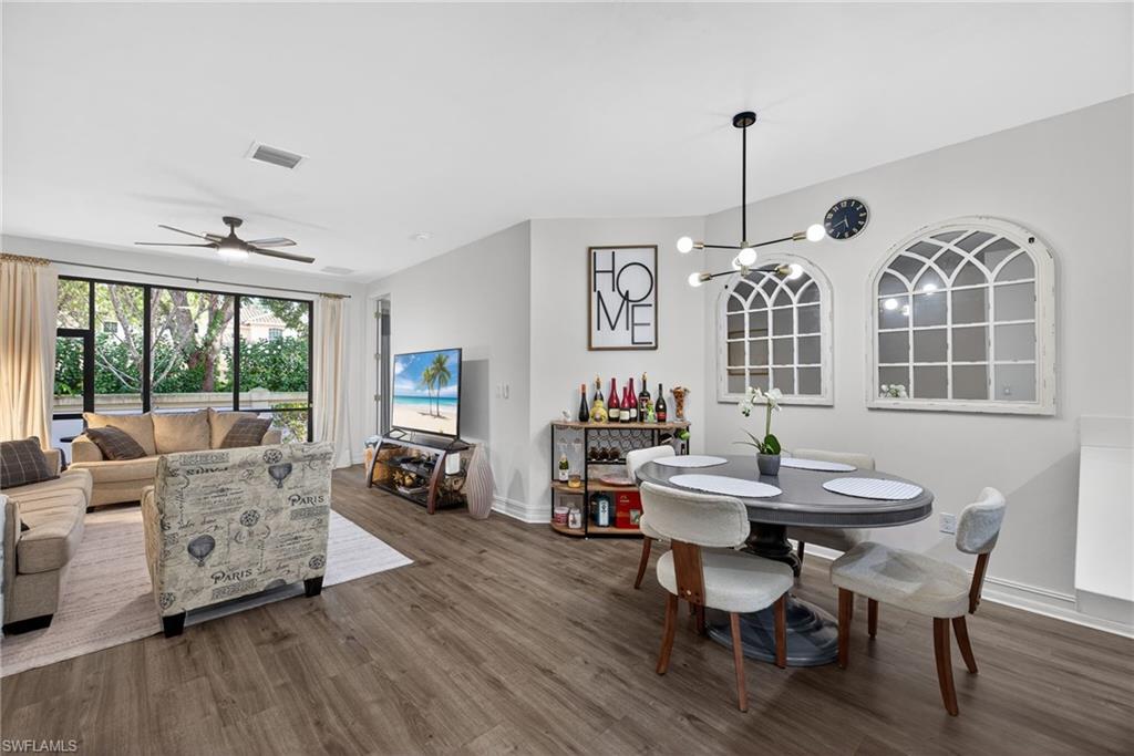 7845 Bristol Circle Naples, FL 34120 - Photo 7 of 31 a view of a dining room with furniture window and outside view