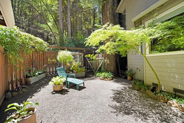 a view of a chair and table in the patio