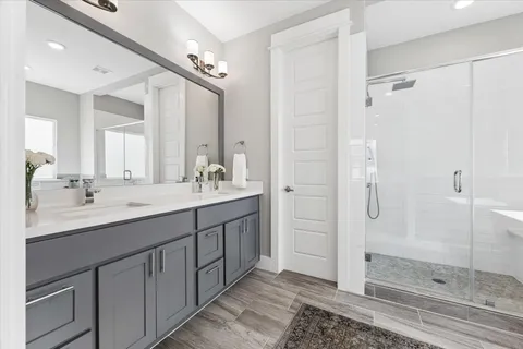 a spacious bathroom with a bathtub and shower