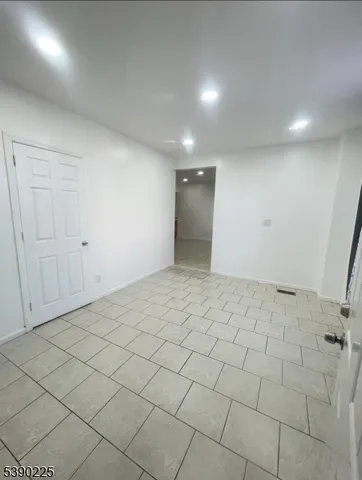 a kitchen with stainless steel appliances a refrigerator sink and cabinets
