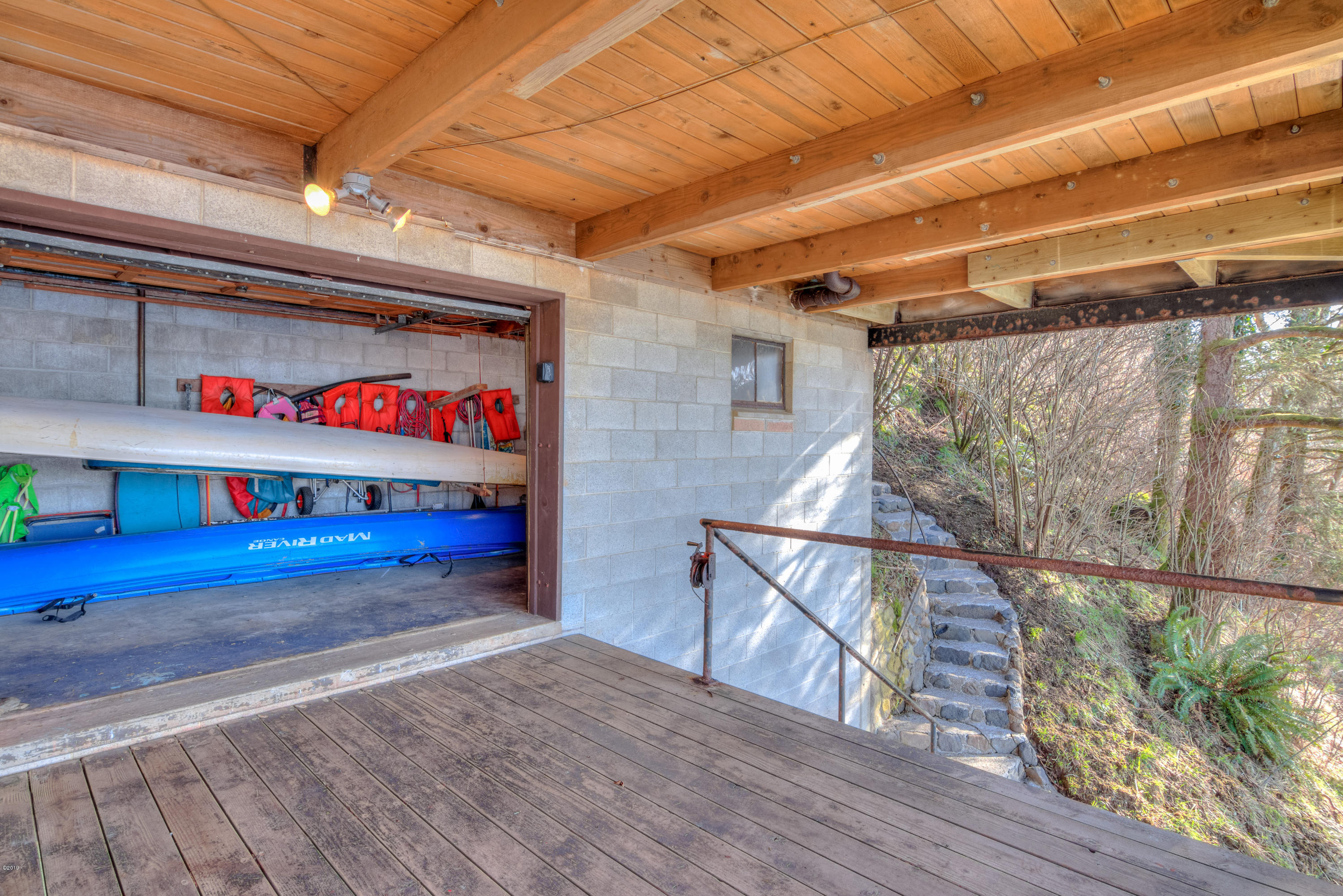 2530 Savage Road Otis, OR 97368 - Photo 29 of 30 Garage door access to storage room