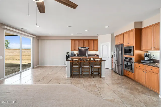 a bedroom with a bed dresser and a window