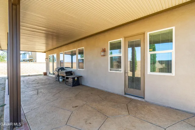 a view of an empty room with windows