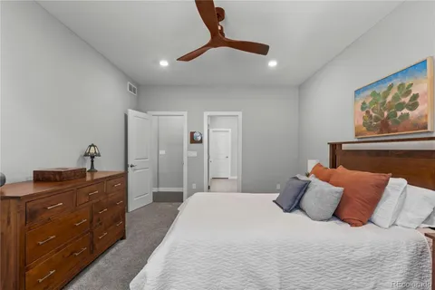 a bedroom with a bed and a dresser