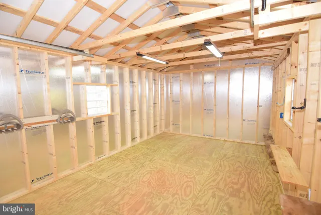 a view of a house with a backyard and a patio