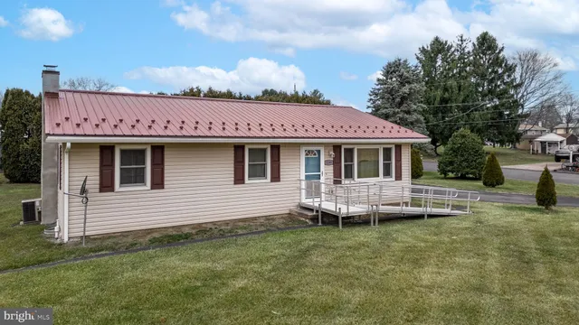 an aerial view of a house with outdoor space