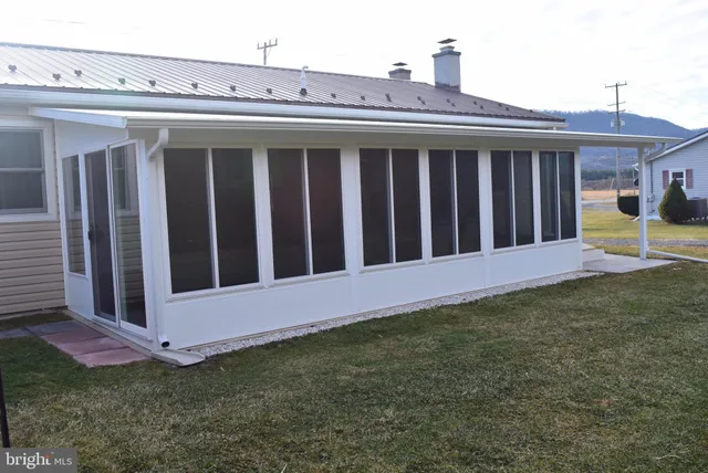 a kitchen with refrigerator cabinets and wooden floor